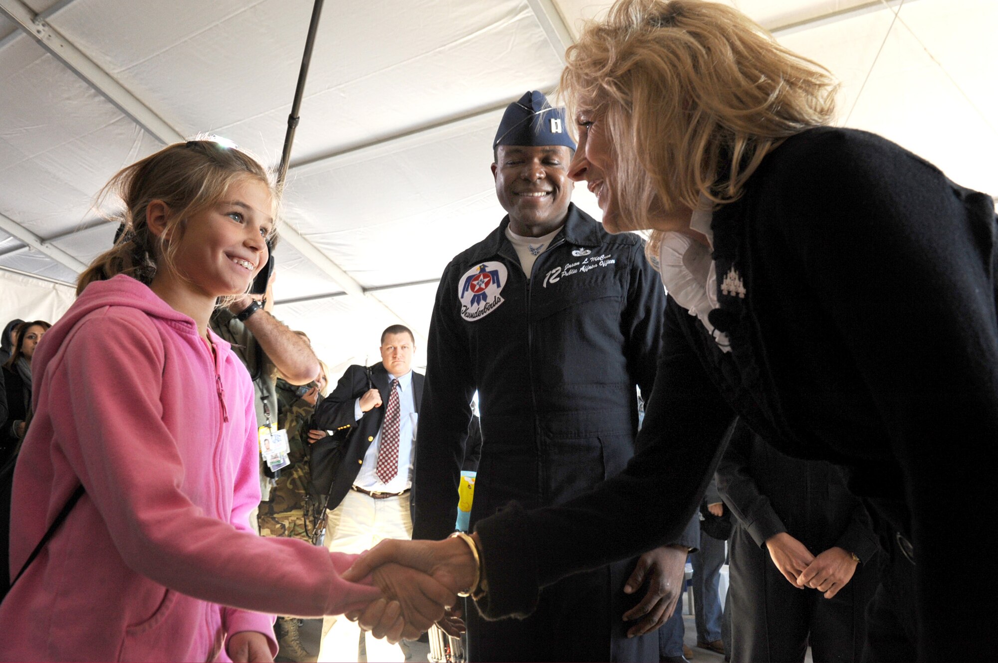 NELLIS AIR FORCE BASE, Nev.-- Dr. Jill Biden meets Tori Routt, daugther of Thunderbird pilot Lt. Col. Derek Routt, during her visit to Nellis Nov. 15. Dr. Biden's visit coincides with Military Family Month as well as Year of the Air Force Family--a one-year period set aside to celebrate the many members of the Air Force Family and provide education and awareness on how Air Force programs and community partners support them.  
(U.S. Air Force photo by Airman 1st Class Jamie Nicley)