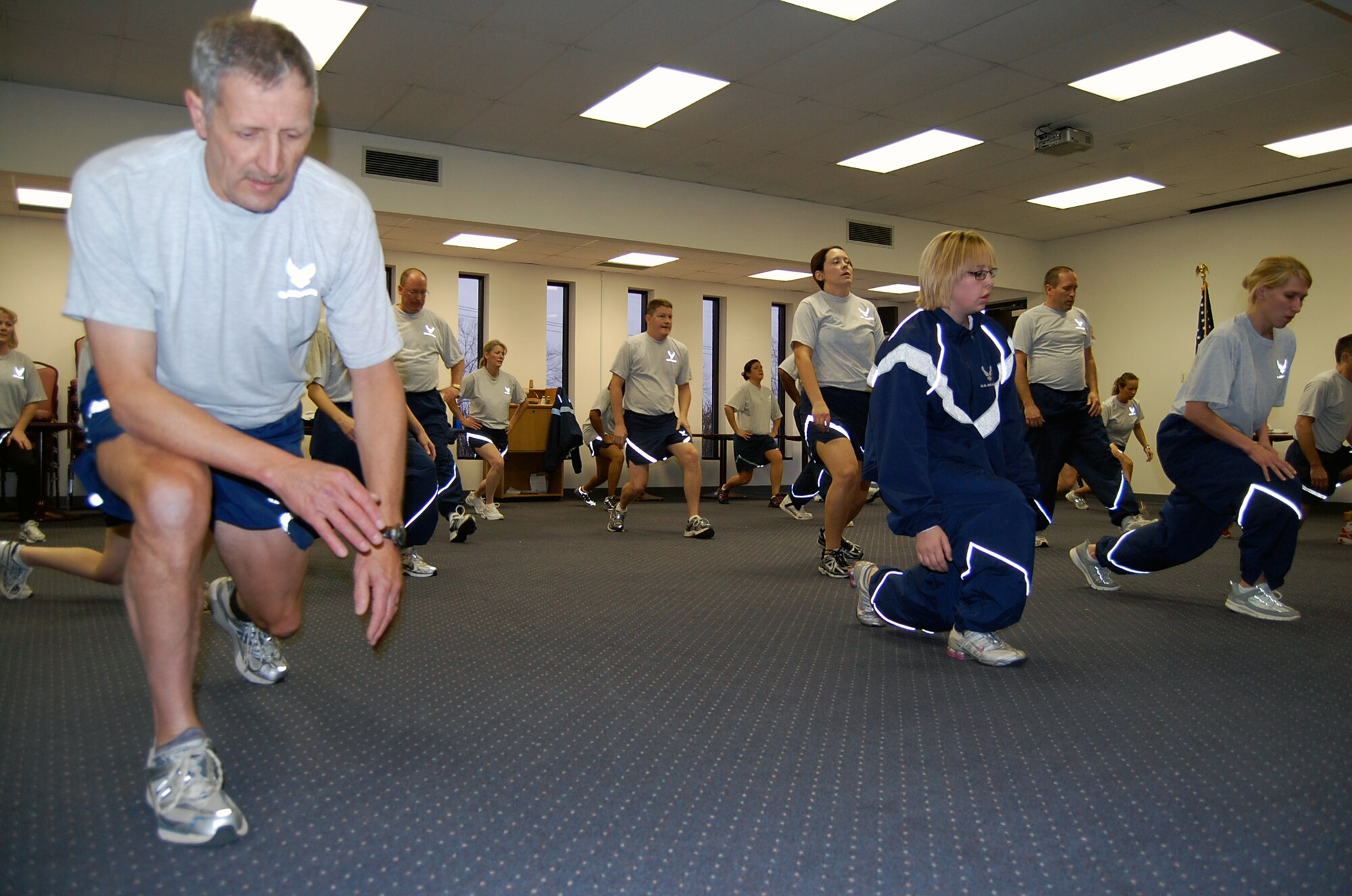 Members from the 131st Medical Group work hard doing self-paced lunges during their morning Physical Training session. With the new fitness standards coming with the new year, the Medical Group knows the importance of staying fit even during the winter months. (Photo by Senior Airman Jessica Donnelly)