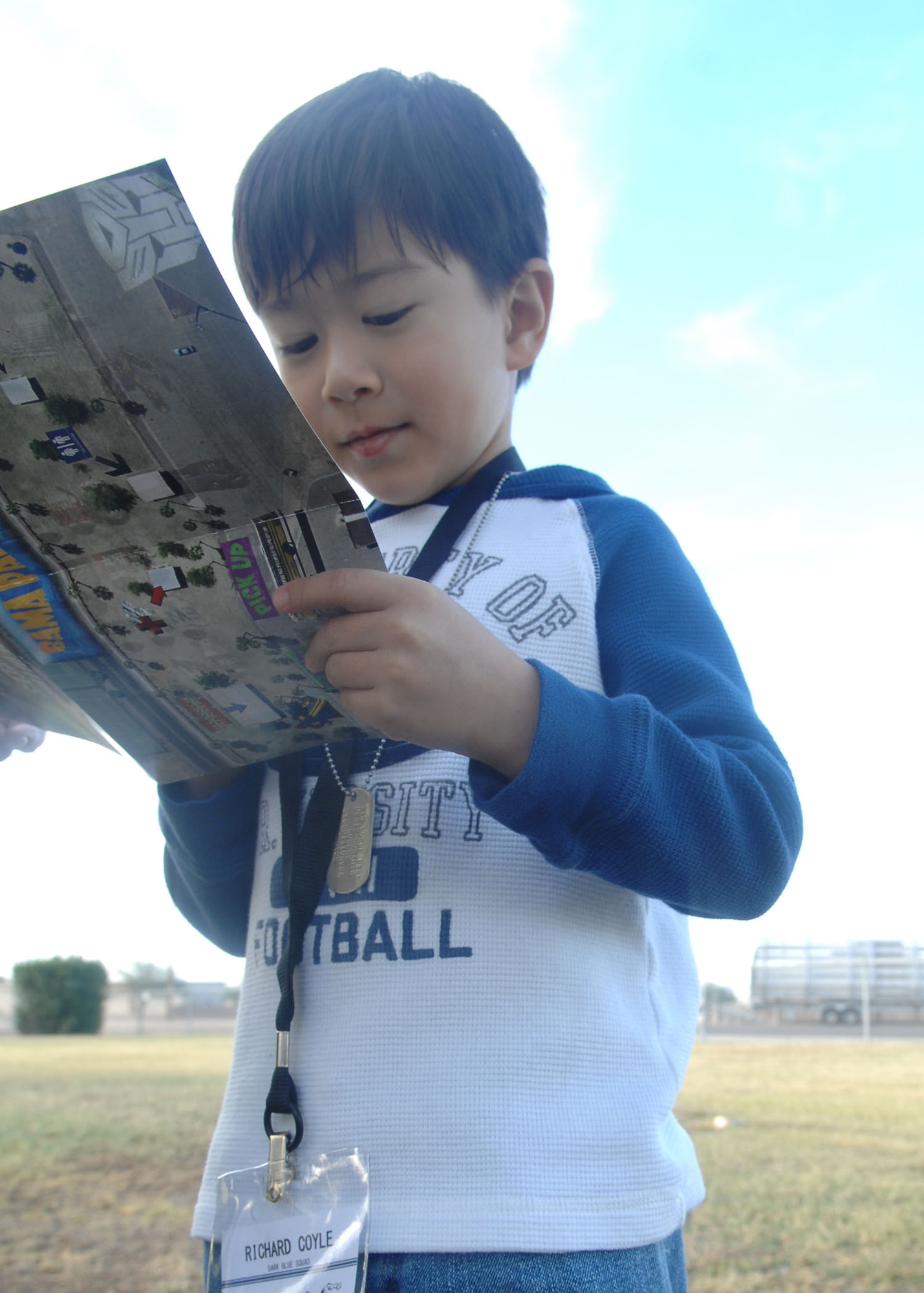 Richard Coyle, 6, son of Chief Master Sgt. Richard Coyle, 355th Medical Group superintendent, studies a map to learn more about his mock deployment here Nov. 7. Richard was joined by both his parents and was one of more than 200 children to participate in this year's Junior Expeditionary Forces event. (U.S. Air Force photo/Airman Jerilyn Quintanilla)
