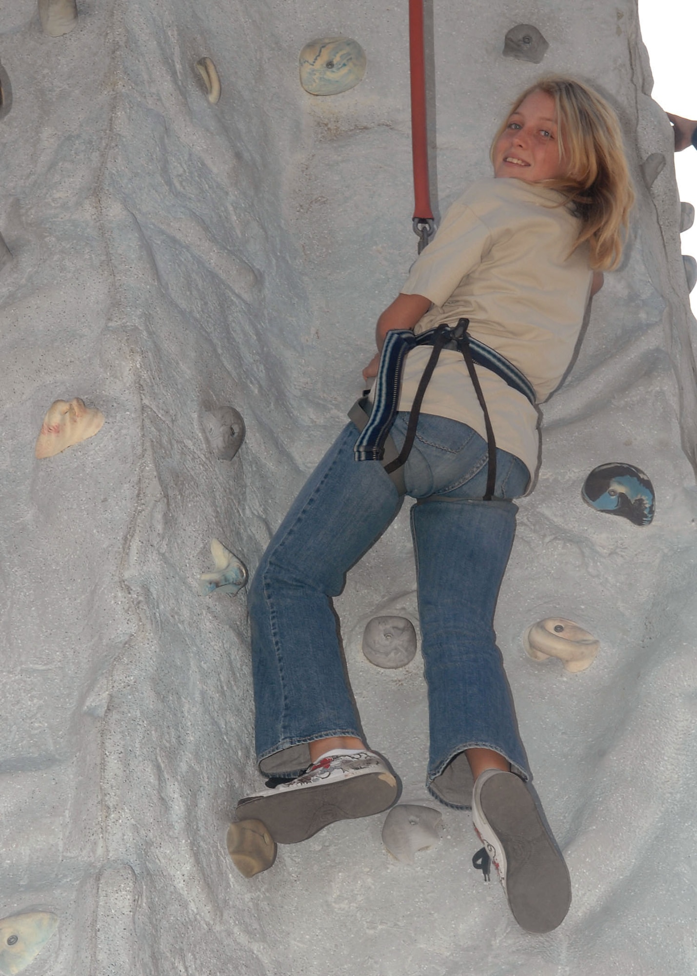 Erin McLeod, 11, daughter of Maj. Raymond Mcleod, 12th Air Force, climbs a rock wall hosted by the Army National Guard here, Nov. 7. This was one of the activites available to the children participating in this year's Junior Expeditionary Forces event, hosted by the Davis-Monthan Airman Family and Readiness Center. (U.S. Air Force photo/Airman Jerilyn Quintanilla)

