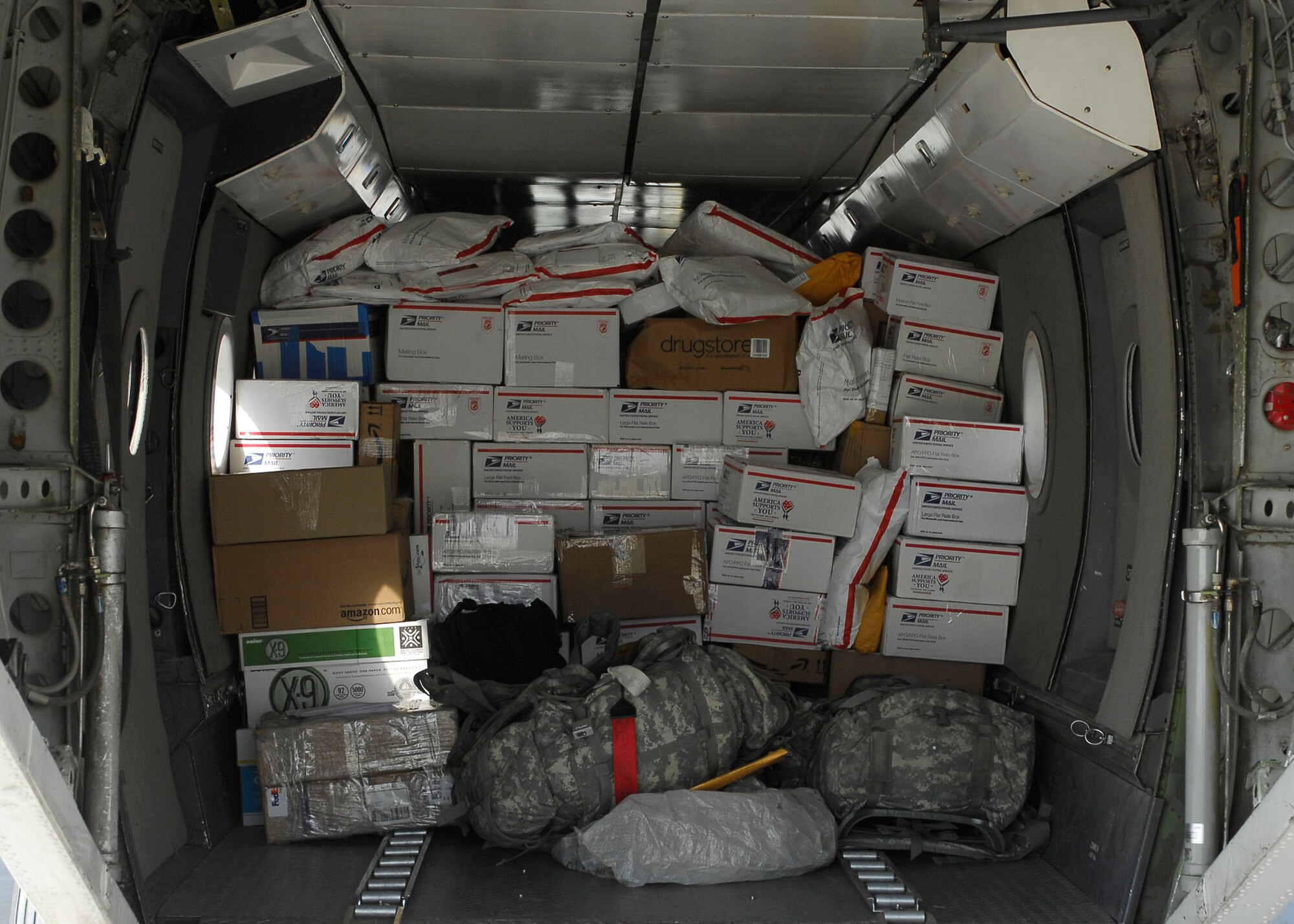BAGRAM AIRFIELD, Afghanistan -- Mail loaded onto an aircraft by the short take off and landing office of the 455th Expeditionary Aerial Port Squadron will be delivered to different forward operating bases Nov. 15, 2009.  The STOL office is in charge of delivering personnel and mail to different FOBs.  (U.S. Air Force photo/Senior Airman Felicia Juenke)