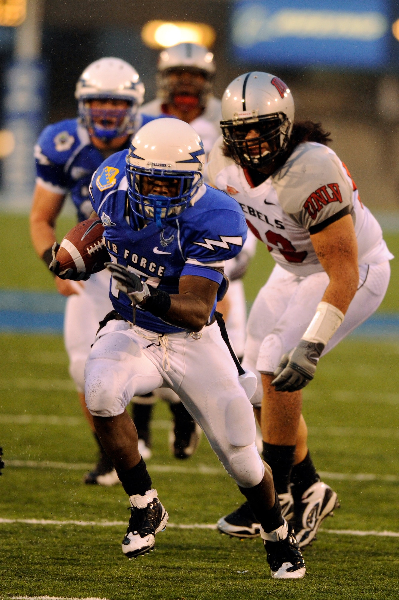 Air Force sophomore running back Asher Clark runs 24 yards for a touchdown against UNLV at Falcon Stadium Nov. 14, 2009. Clark, a native of Lawrenceville, Ga., had a career-high 160 rushing yards and three touchdowns in Air Force's 45-17 victory. (U.S. Air Force photo/Bill Evans)

U.S. Air Force Academy, CO -- So. RB Asher ClarkRuns for a touchdown against the UNLV Rebels during their 14 November 2009 contest. Air Force Photo/Bill Evans