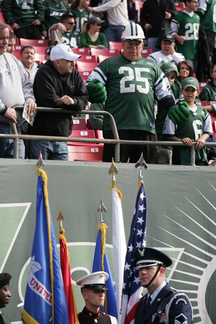 EAST RUTHERFORD, N.J. -- A joint-service color guard prepares for a pre-game ceremony at Giants Stadium, Nov. 15. Marine Corps, Air Force, Navy, Coast Guard and Army service members participated in a tribute to veterans before the game. A Coast Guard detachment sang the National Anthem and were joined by a joint-service color guard before the New York Jets game against the Jacksonville Jaguars. Chief Master Sgt. James A. Roy, Chief Master Sergeant of the Air Force, presented the coin for the pre-game coin toss.(Official Marine Corps photo by Sgt. Randall A. Clinton)