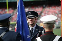 EAST RUTHERFORD, N.J. -- A joint-service color guard prepares for a pre-game ceremony at Giants Stadium, Nov. 15. Marine Corps, Air Force, Navy, Coast Guard and Army service members participated in a tribute to veterans before the game. A Coast Guard detachment sang the National Anthem and were joined by a joint-service color guard before the New York Jets game against the Jacksonville Jaguars. Chief Master Sgt. James A. Roy, Chief Master Sergeant of the Air Force, presented the coin for the pre-game coin toss.(Official Marine Corps photo by Sgt. Randall A. Clinton)