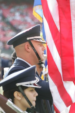 EAST RUTHERFORD, N.J. -- A joint-service color guard prepares for a pre-game ceremony at Giants Stadium, Nov. 15. Marine Corps, Air Force, Navy, Coast Guard and Army service members participated in a tribute to veterans before the game. A Coast Guard detachment sang the National Anthem and were joined by a joint-service color guard before the New York Jets game against the Jacksonville Jaguars. Chief Master Sgt. James A. Roy, Chief Master Sergeant of the Air Force, presented the coin for the pre-game coin toss.(Official Marine Corps photo by Sgt. Randall A. Clinton)