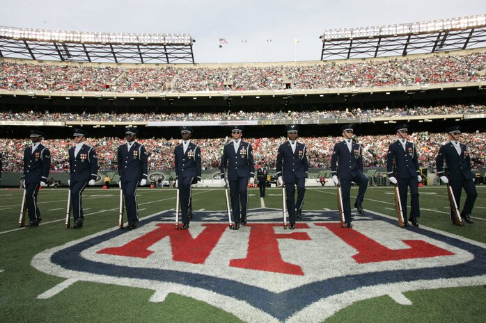 EAST RUTHERFORD, N.J. -- The Air Force Honor Guard Drill Team performs at halftime of the New York Jets vs Jacksonville Jaguars football game at Giants Stadium, Nov. 15. They are the traveling component of the USAF Honor Guard and inspires Air Force awareness among military and civilian audiences through its complex drill routine. In all they do, the Drill Team personifies the integrity, discipline, teamwork, and professionalism of every Airman and every Air Force mission. During the Air Force Honor Guard's 60-year history, the Drill Team has performed in every state of the union and many countries abroad(Official Marine Corps photo by Sgt. Randall A. Clinton)