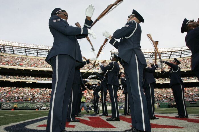 EAST RUTHERFORD, N.J. -- The Air Force Honor Guard Drill Team performs at halftime of the New York Jets vs Jacksonville Jaguars football game at Giants Stadium, Nov. 15. They are the traveling component of the USAF Honor Guard and inspires Air Force awareness among military and civilian audiences through its complex drill routine. In all they do, the Drill Team personifies the integrity, discipline, teamwork, and professionalism of every Airman and every Air Force mission. During the Air Force Honor Guard's 60-year history, the Drill Team has performed in every state of the union and many countries abroad(Official Marine Corps photo by Sgt. Randall A. Clinton)