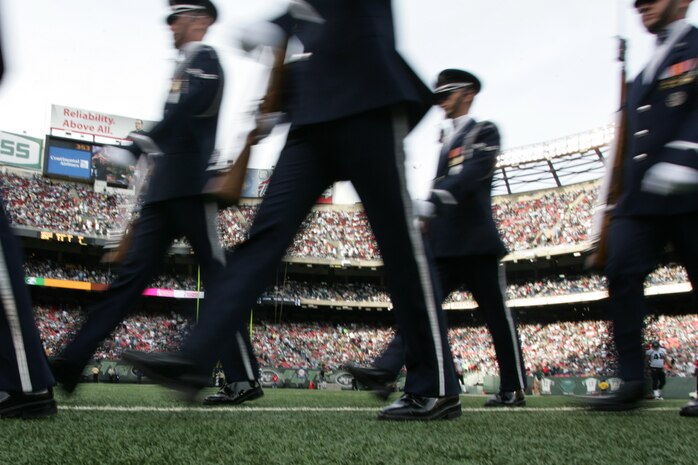 EAST RUTHERFORD, N.J. -- The Air Force Honor Guard Drill Team performs at halftime of the New York Jets vs Jacksonville Jaguars football game at Giants Stadium, Nov. 15. They are the traveling component of the USAF Honor Guard and inspires Air Force awareness among military and civilian audiences through its complex drill routine. In all they do, the Drill Team personifies the integrity, discipline, teamwork, and professionalism of every Airman and every Air Force mission. During the Air Force Honor Guard's 60-year history, the Drill Team has performed in every state of the union and many countries abroad(Official Marine Corps photo by Sgt. Randall A. Clinton)