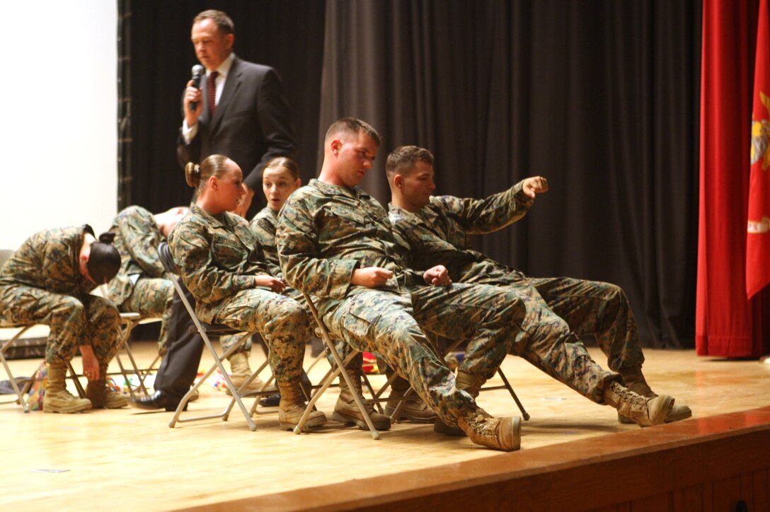 Marines take a "drive" after having a few drinks during a safety magic and hypnosis show  on Camp Lejeune. Professional hypnotist, Bryan McDaniel, hosted the hypnosis show at the base theater, Nov. 16.