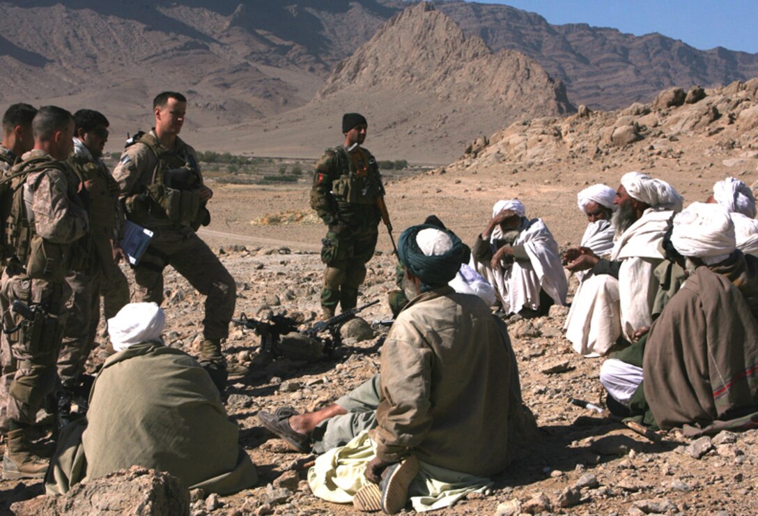 Marines from India Company, 3rd Battalion, 4th Marine Regiment speak with local elders during a patrol of She Gosa Janobi, Afghanistan Nov. 16. The patrol was part of Operation North Star which patrolled nearby villages of the notoriously dangerous Buji Bhast Pass Nov. 15 through 17.