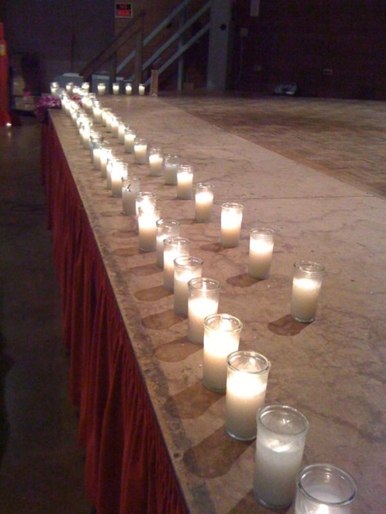 HONOLULU -- A candlelight vigil with more than 100 attendees including
community members, agencies, and the Honoulu Police Department, was held at
Lester McCoy Pavilion at Ala Moana Park Oct. 28 to remember and honor the victims
who had lost their lives due to domestic violence.  Hickam's Family Advocacy
Program chaired the planning committee which was made up of more than 15
different agencies, military branches, and community members. The event
included display, speeches from survivors of domestic violence, hula
dancing, participants were presented with forget-me-not seeds and the vigil
ended  with a moving candlelight ceremony.  For help or information, please
contact Family Advocacy at 449-0175 or the Hickam AFB Domestic Violence
Victim Advocate at 449-0187. (Courtesy photo)
