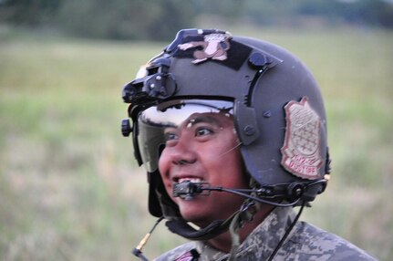 ILOPANGO, El Salvador – Army Spc. Bryan Fulgado, a HH-60 Blackhawk crew chief assigned to Joint Task Force-Bravo, smiles Nov. 16 at the end of another great day of El Salvador humanitarian relief. The four Joint Task Force-Bravo helicopters transported 97,000 pounds of relief supplies today reaching 315,200 total pounds delivered since Nov. 11(U.S. Air Force photo/Staff Sgt. Chad Thompson).