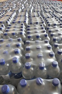 ILOPANGO, El Salvador – Thousands of pounds of water bottles sit and wait for distribution Nov. 16. The four Joint Task Force-Bravo helicopters transported 97,000 pounds of relief supplies today reaching 315,200 total pounds delivered since Nov. 11 (U.S. Air Force photo/Staff Sgt. Chad Thompson).