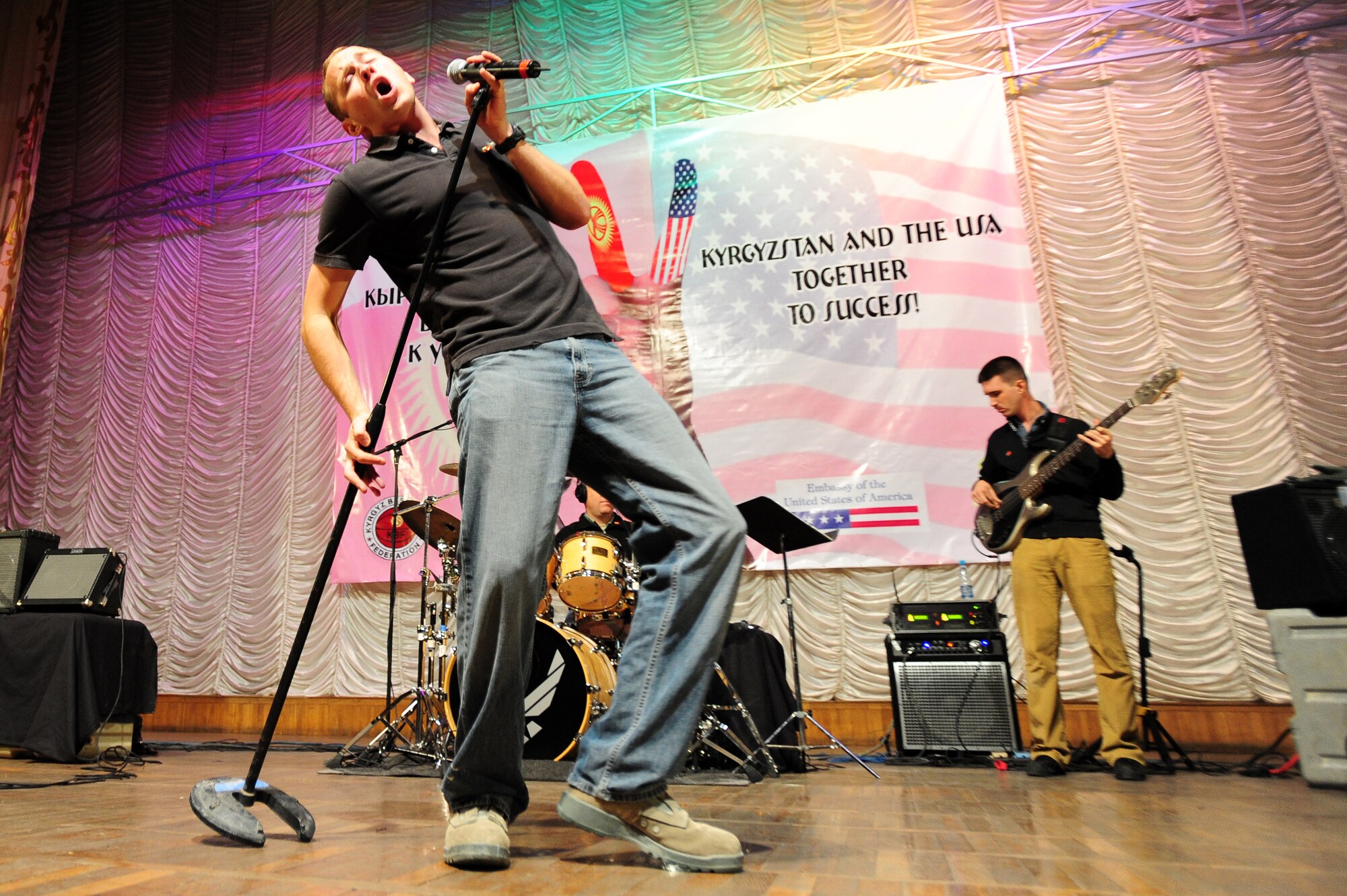BISHKEK, Kyrgyzstan -- Airman 1st Class Clayton Lee, U.S. Air Forces Central Sirocco Band vocalist, performs at the Seitek Youth Center, Nov. 14, 2009. The Sirocco Band plays a wide variety of rock, oldies, and pop music. They are stationed at a base in Southwest Asia and are deployed from Lackland Air Force Base, Texas. (U.S. Air Force photo/Senior Airman Steele C. G. Britton)