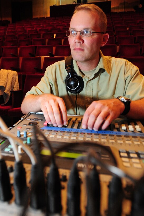 BISHKEK, Kyrgyzstan -- Staff Sgt. Brendan Fine, U.S. Air Forces Central Sirocco Band audio technician, ensures sound is correct prior to a performance at the Seitek Youth Center, Nov. 14, 2009. The Sirocco Band members are stationed at a base in Southwest Asia and are deployed from Lackland Air Force Base, Texas. (U.S. Air Force photo/Senior Airman Steele C. G. Britton)