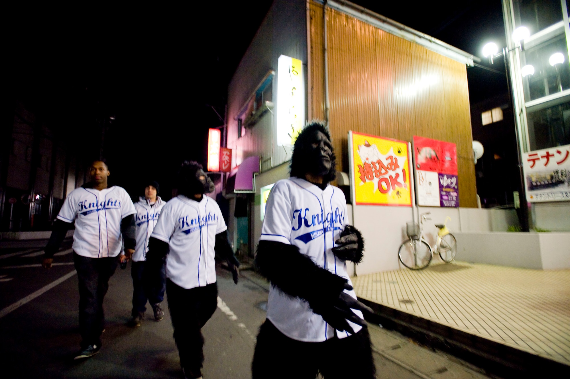 MISAWA AIR BASE, Japan -- Members of Monkeys Against Drunk Driving walk the streets of downtown Misawa Nov. 15. M.A.D.D., conceived by 35th Maintenance Squadron's Staff Sgt. John Rorie, provides free rides to members of the Misawa Air Base community to prevent drinking and driving. M.A.D.D. regularly sets up its tent in the Base Exchange parking lot and has given 675 people safe rides home since they started Aug. 8. (U.S. Air Force photo/Staff Sgt. Samuel Morse)