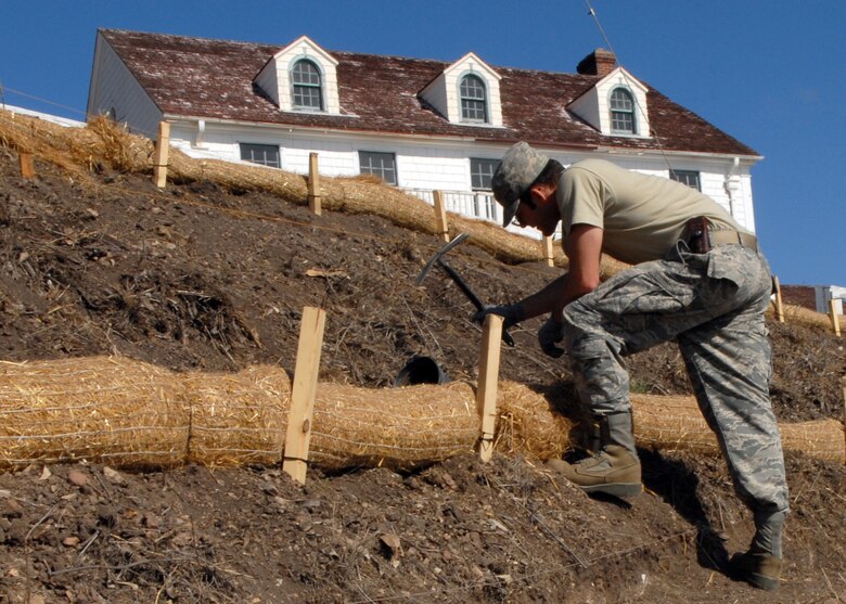 VANDENBERG AIR FORCE BASE, Calif. -- Staff Sgt. Thomas Gerhart, member of the 30th Civil Engineer Squadron, digs a hole in preparation for planting during National Public Lands Day at the boat house here Friday, Nov. 13, 2009. The Boat House has been part of the Vandenberg since 1936, when it was used as a rescue station for the U.S. Coast Guard. (U.S. Air Force photo/Airman 1st Class Kerelin Molina)