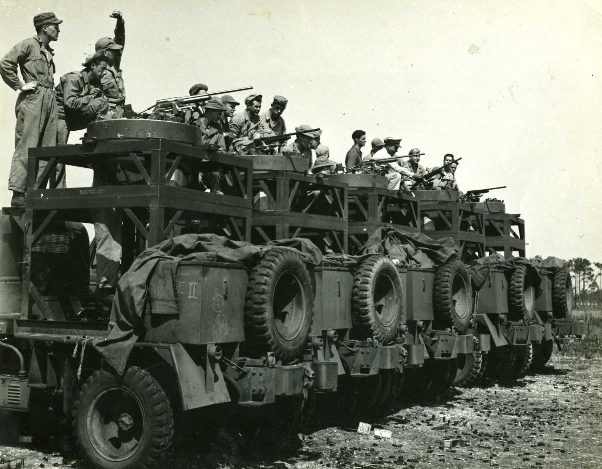 Gunnery Students practice on gun turrets mounted on trucks. The turrets had been modified to fire shotgun shells.

