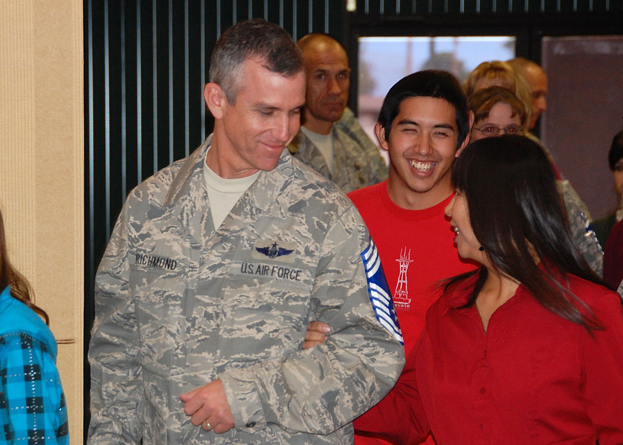 Senior Master Sgt. Robert Richmond, 41st Electronic Combat Squadron superintendent, enters the Mirage Club with his wife, Masako, Nov. 13 during a celebration honoring his recent selection to chief master sergeant. In total, 11 of Davis-Monthan's senior master sergeants earned this prestigious promotion. The chief-selects and their families were recognized during a ceremony hosted by the Davis-Monthan Chiefs' group. (U.S. Air Force photo/Capt. Stacie N. Shafran)
