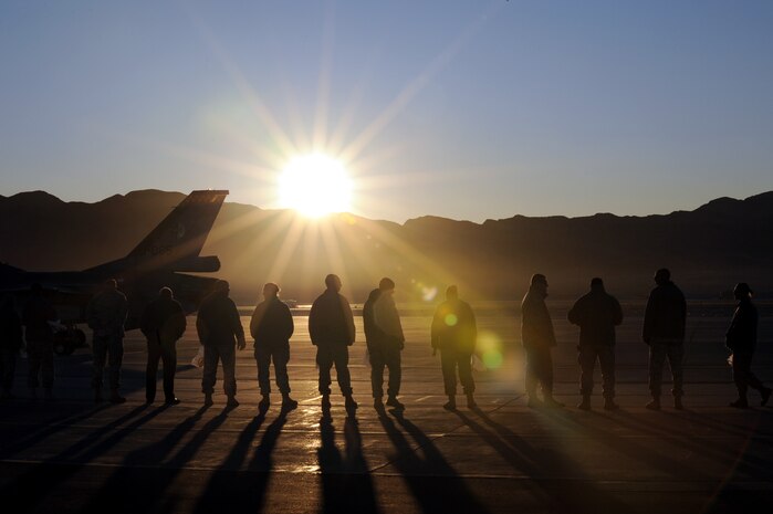 NELLIS AIR FORCE BASE, Nev. -- Nellis Airmen line up along the flightline to perform a foreign object debris walk following the 2009 Aviation Nation Nellis open house, Nov. 16. FOD prevention is every individual's responsibilities as it can cost millions of dollars, and cause damage to aircraft systems or weapons or injury to personnel. 
(U.S. Air Force photo by Airman 1st Class Brett Clashman)