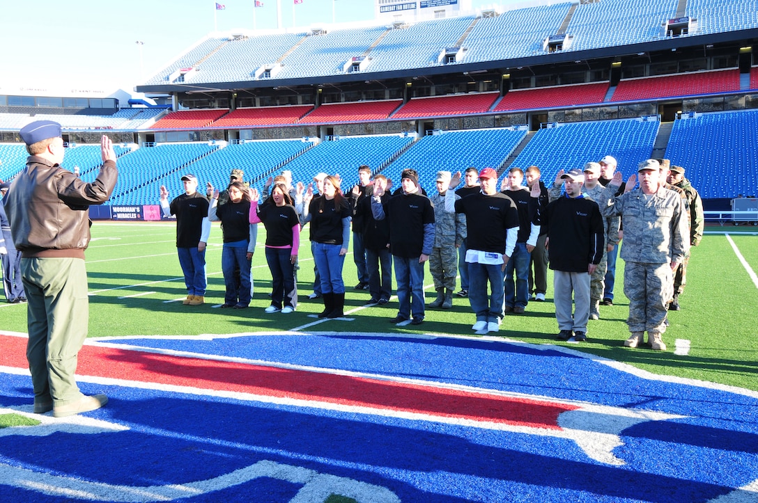 NIAGARA FALLS AIR RESERVE STATION, N.Y. -- The 914th Airlift Wing recruiting office holds a mass enlistment ceremony October 11 at Ralph Wilson Stadium, home of the National Football League Buffalo Bills, Orchard Park, N.Y.  The oath of enlistment is given by Col. Allan L. Swartzmiller, 914 AW commander. (U.S Air Force photo by Staff Sgt. Joseph McKee)