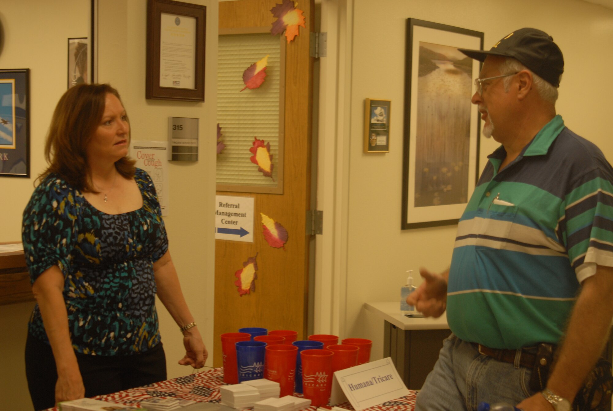 Ms. Ricky Zuniga, Tricare Beneficiary Service representative talks to Terry Cook, retired Navy about Tricare benefits during the Goodfellow Military Retirees Appreciation Day and Health Fair, Nov. 14 at the Goodfellow clinic. ( U.S. Air Force photo/Airman 1st Class Anne Gathua)