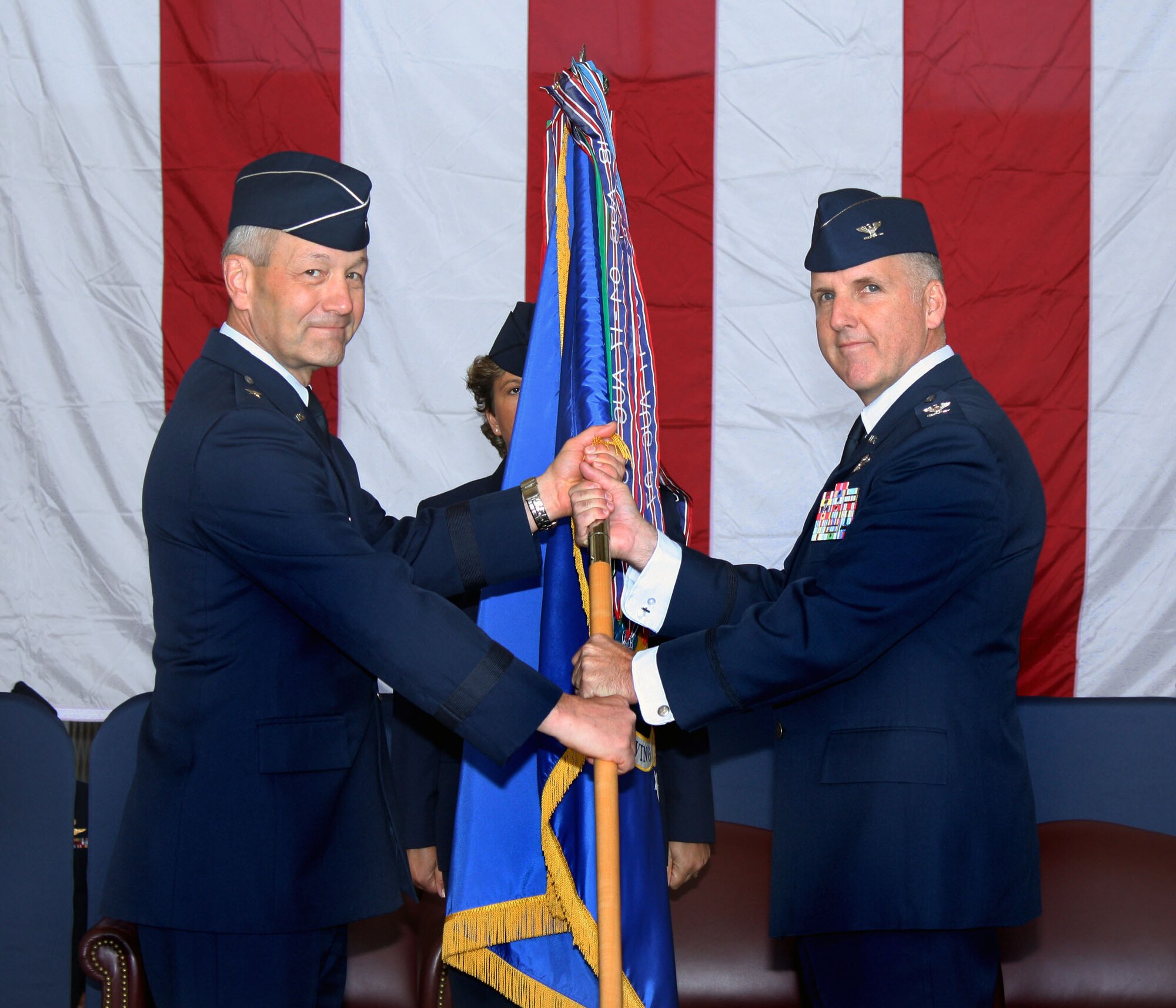 TRAVIS AIR FORCE BASE, Calif. -- Brig. Gen. Eric W. Crabtree, 4th Air Force commander (left), passes the flag of the 349th Air Mobility Wing to Col. John (Jay) C. Flournoy, Jr., in a change of command ceremony here Nov. 15, 2009. Colonel Flournoy assumes command of the Air Force Reserve Command’s largest associate wing from Brig. Gen. Maryanne Miller, who has been assigned to a position in the Pentagon. The ceremony was well attended by members of Team Travis and the local community. The change of command ceremony is a time-honored tradition which formally symbolizes the continuity of authority as the command is passed from one officer to another.  (U.S. Air Force photo / Lt. Col. Robert Couse-Baker)
