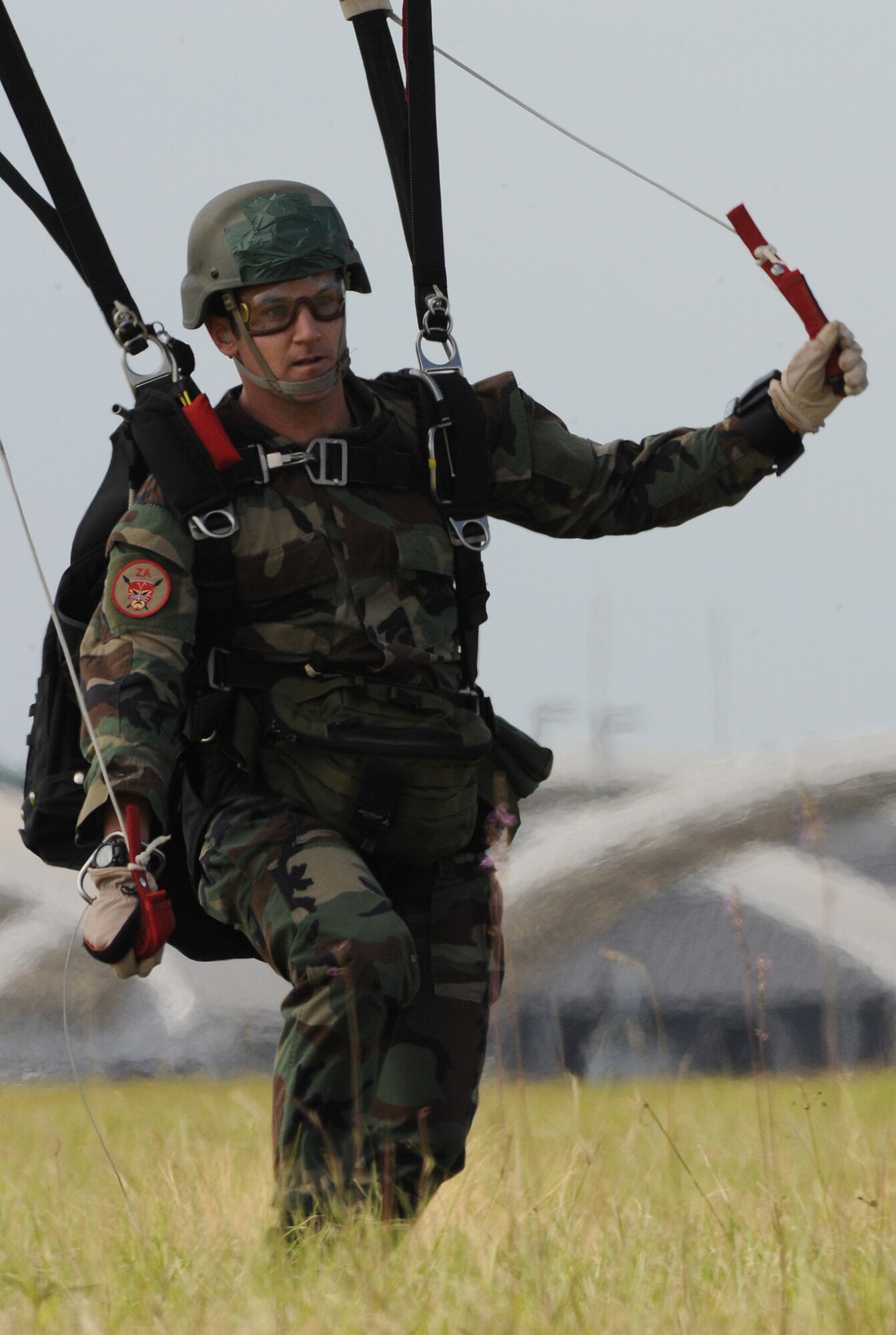 MOODY AIR FORCE BASE, Ga. -- Capt. Aaron Zamora, a combat rescue officer assigned to the 23rd Special Tactics Squadron at Hurlburt Field, Fla., lands after a free-fall jump during a training exercise here Oct. 29. Training jumps are conducted to increase free-fall proficiency and prepare members for deployment missions. (U.S. Air Force photo by Staff Sgt. Elizabeth Rissmiller)
