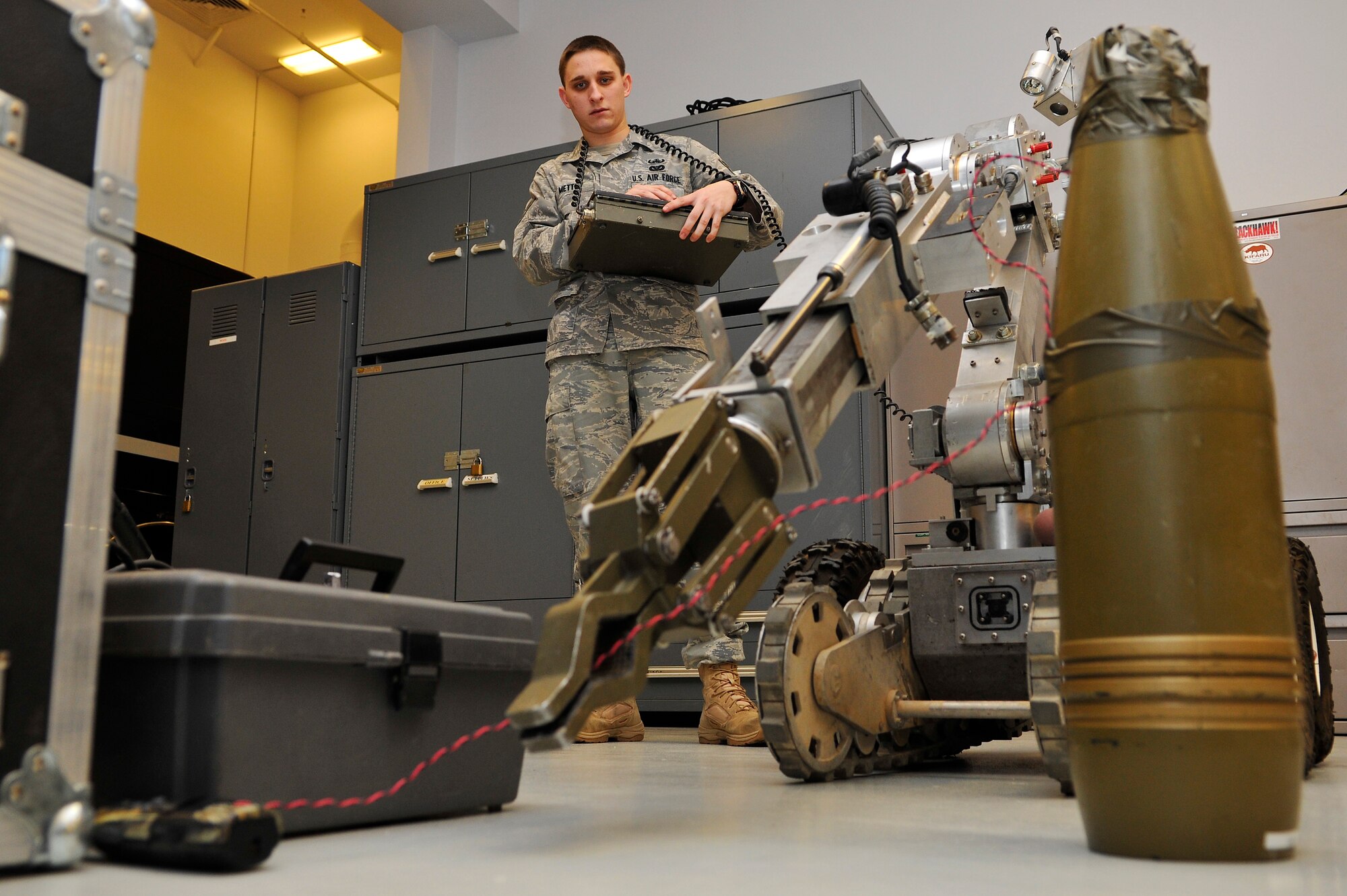 Airman 1st Class Daniel Metts uses an F6 robot to remotely remove components of an improvised explosive device during the Pacific Air Forces Explosive Ordnance Disposal Safety Day Nov. 13, 2009, Eielson Air Force Base, Alaska. The safety day was designed for EOD Airmen to focus on standard operating procedures, tactics, techniques, as well as their health and well-being. Airman Metts is an explosive ordnance technician assigned to the 354th Civil Engineer Squadron. (U.S. Air Force photo/Staff Sgt. Christopher Boitz)