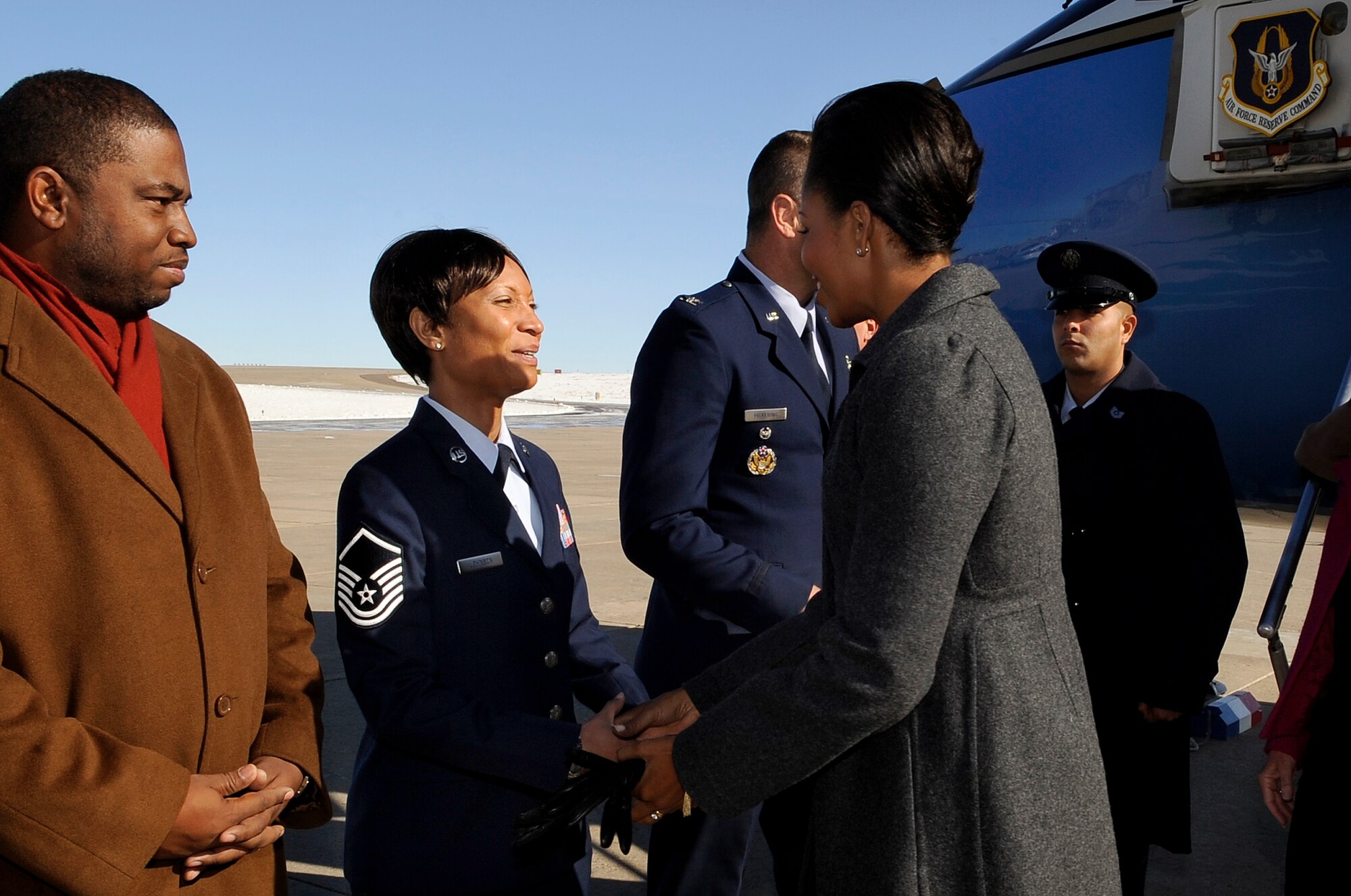 BUCKLEY AIR FORCE BASE, Colo. -- First Lady Michelle Obama is greeted by Master Sgt. Derinda Johnson, 460th Space Wing staff first sergeant, as she arrives at Buckley Air Force Base Nov. 16. (U.S. Air Force photo by Staff Sgt. Steve Czyz)