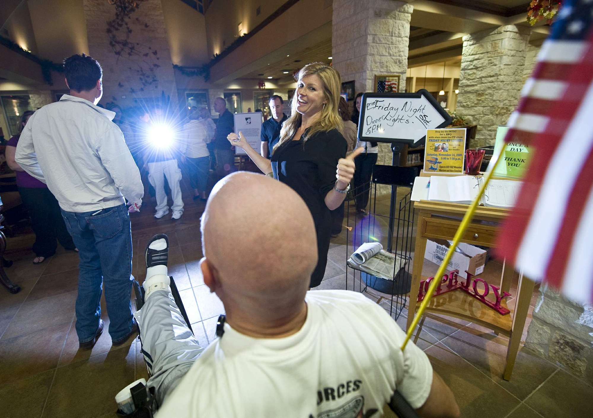 "Friday Night Lights" actress Connie Britton talks to Army Sgt. 1st Class Todd Griffin Nov. 14, 2009, at the Warrior and Family Support Center on Fort Sam Houston, Texas. (U.S. Air Force photo/Staff Sgt. Bennie Davis)