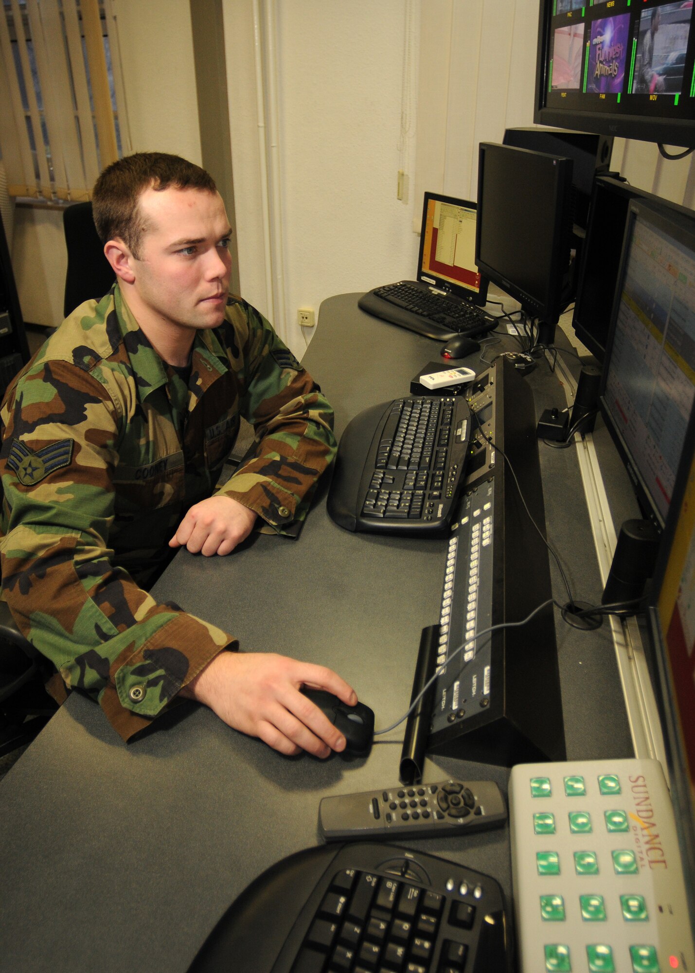 BITBURG ANNEX, Germany -- Senior Airman Jacob Cooney, American Forces Network Spangdahlem broadcast maintenance technician, updates a television database here Nov. 12. Airman Cooney maintains the equipment that enables television and radio to broadcast to the local area. (U.S. Air Force photo/Airman 1st Class Nathanael Callon)