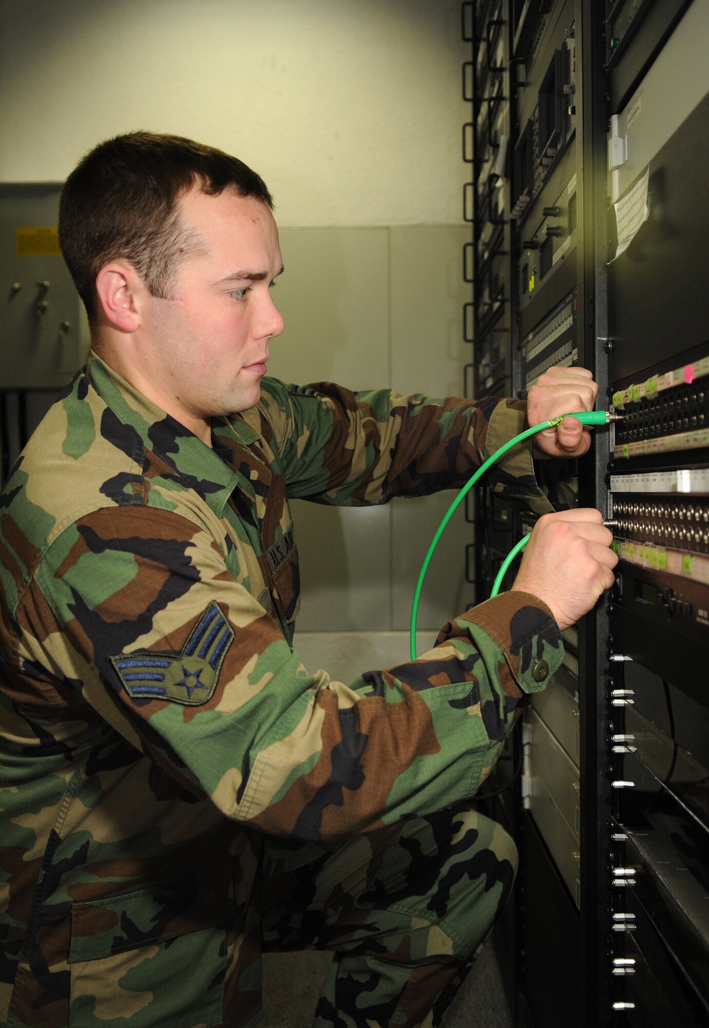 BITBURG ANNEX, Germany -- Senior Airman Jacob Cooney, American Forces Network Spangdahlem broadcast maintenance technician, patches video here Nov. 12. Airman Cooney ensures the television and radio broadcasts work properly to keep members of Team Eifel informed and entertained. (U.S. Air Force photo/Airman 1st Class Nathanael Callon)