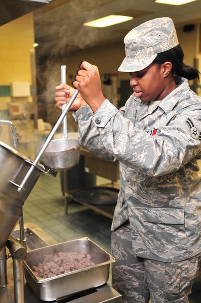 Airman 1st Class Whitney Camron, 4th Force Support Squadron food service journeyman, removes beef cubes from a steam cooker at the Southern Eagles Dinning Facility on Seymour Johnson Air Force Base, N.C., Nov. 10, 2009. Steaming food helps keep food moist. Airman Camron is originally from Louisville, Ky. (U.S. Air Force Photo/Airman 1st Class Rae Perry)