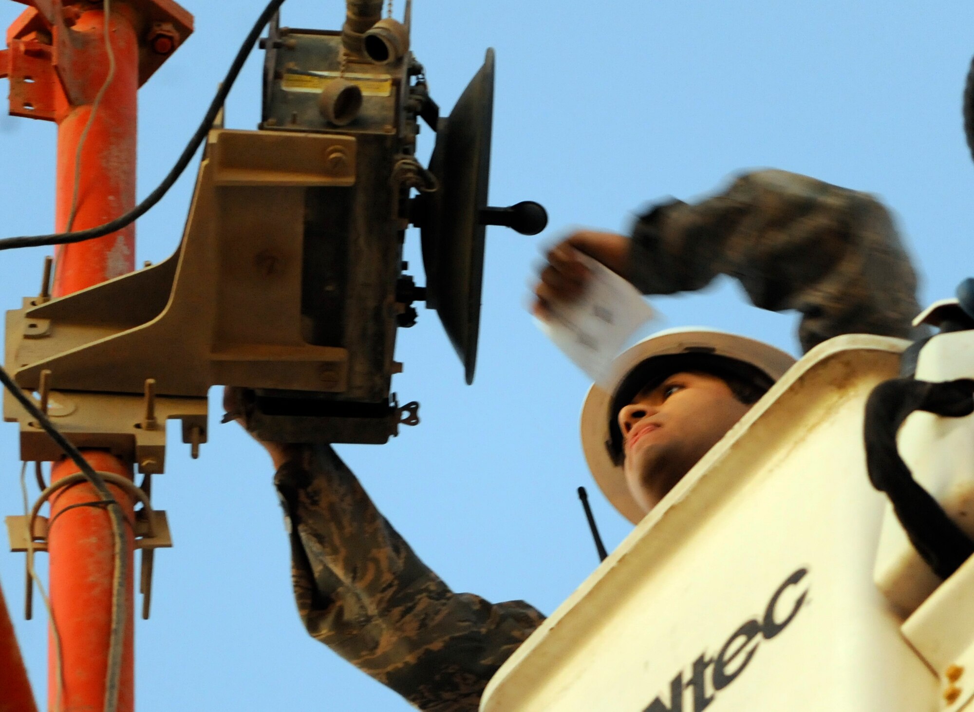 SOUTHWEST ASIA - Airman 1st Class David Amaya, 380th Expeditionary Communications Squadron, works on communication equipment as the sun rises Nov. 15, 2009. Airman Amaya is deployed from Ramstein Air Base, Germany and grew up in Los Angeles. (U.S. Air Force photo/Senior Airman Stephen Linch)

 

