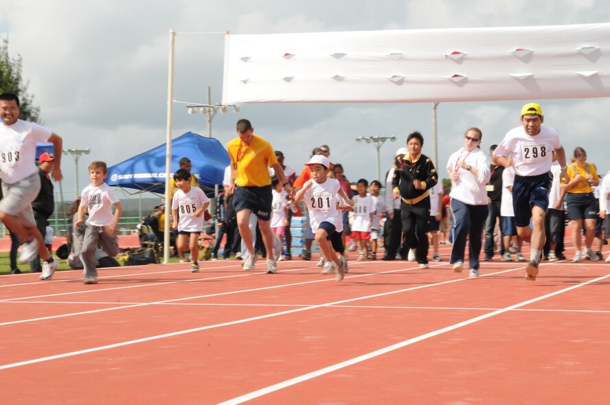 Kazuki Higa, number 201, runs hard at the Kadena Special Olympics, held Nov. 14 at Kadena Air Base, Japan. (U.S. Air Force Photo/Airman 1st Class Amanda Grabiec) 
