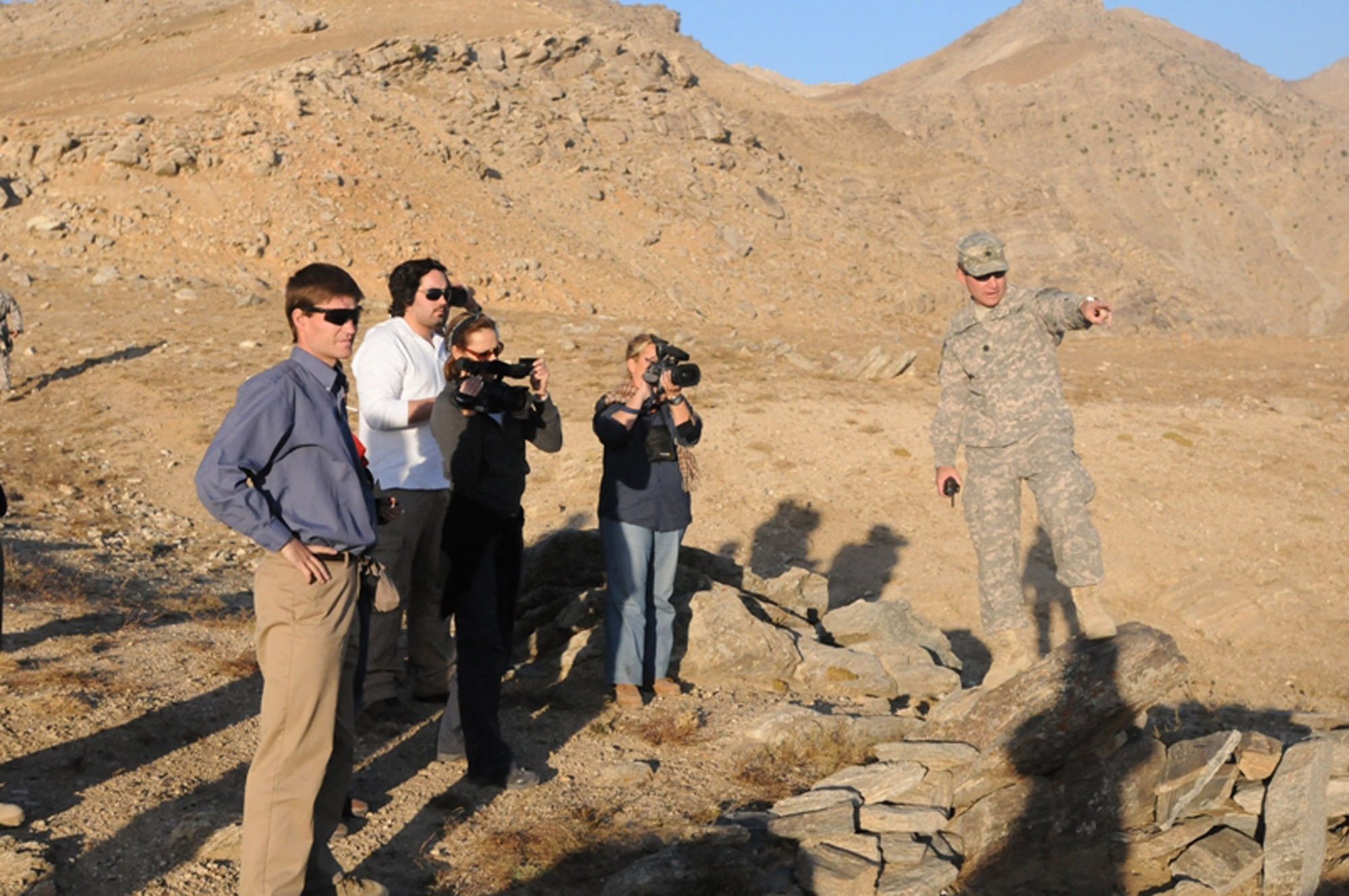 PANJSHIR PROVINCE, Afghanistan -- Panjshir Provincial Reconstruction Team commander, Lt. Col. Eric Hommel (right), explains the historical significance of the Daraband Pass to several NATO journalists with U.S. Aid for International Development representative to the PRT, Mr. Jeremy Lewis (left), in Panjshir province, Afghanistan, recently. The U.S. military presence is vital to providing the resources to maintain security in the valley enabling civilian organizations to spearhead development efforts. (U.S. Air Force photo/Capt. John Stamm)