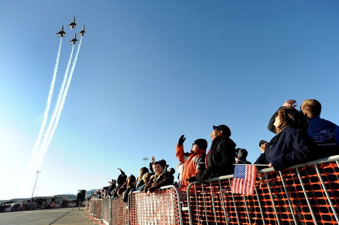 NELLIS AIR FORCE BASE, Nev.-- Thunderbird F-16s perform the diamond formation during the 2009 Aviation Nation Nellis Open House. The open house is an opportunity for the Las Vegas community to view aerial demonstrations and static displays of various aircraft from the military. The open house also acts as the final air show of the year for the U.S. Air Force Air Demonstration Team "Thunderbirds." (U.S. Air Force photo by Tech. Sgt. Michael R. Holzworth)