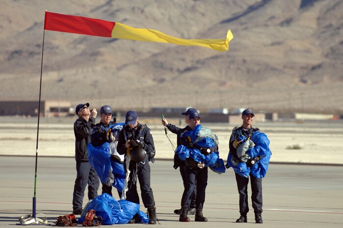 NELLIS AIR FORCE BASE, Nev.--  The U.S. Air Force Academy Parachute Team "Wings of Blue" combined cadet and instructor demonstration team take wind speeds and spot for team mates while performing during the Aviation Nation Nellis Open House Nov. 15. The open house is an opportunity for the Las Vegas community to view aerial demonstrations and static displays of various aircraft from the military. The open house also acts as the final air show of the year for the U.S. Air Force Air Demonstration Squadron Thunderbirds.
(U.S. Air Force photo by Tech. Sgt. Michael R. Holzworth)
