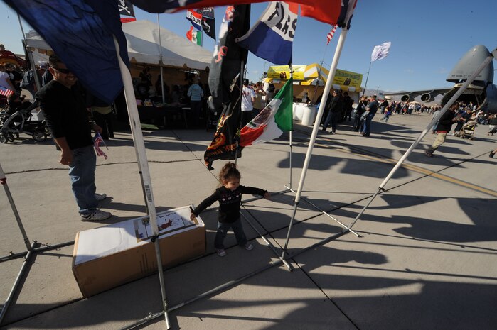NELLIS AIR FORCE BASE, Nev.-- Echo Quintana, a 2-year-old Las Vegas citizen, plays inside a row of flags Nov. 14. The Nellis Air Force Base Open House is an opportunity for the Las Vegas community to view aerial demonstrations and static displays of various aircraft from the military. The open house also acts as the final air show of the year for the U.S. Air Force Aerial Demonstration Squadron Thunderbirds.
(U.S. Air Force photo by Master Sgt. Kevin J. Gruenwald)
