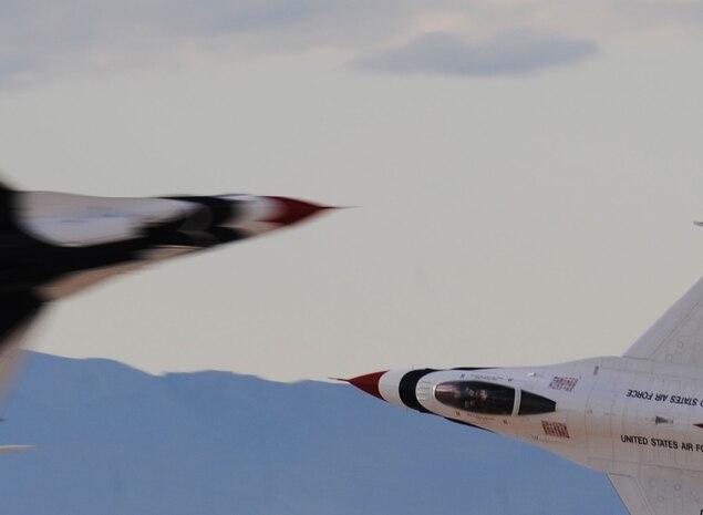 NELLIS AIR FORCE BASE, Nev.-- The United States Air Force Air Demonstration Squadron Thunderbirds opposing solos demonstrate the knife-edge pass over Nellis Nov. 14. The Nellis Open House is an opportunity for the Las Vegas community to view aerial demonstrations and static displays of various aircraft from the military. The open house also acts as the final air show of the year for the Thunderbirds. 
(U.S. Air Force photo by Master Sgt. Kevin J. Gruenwald)