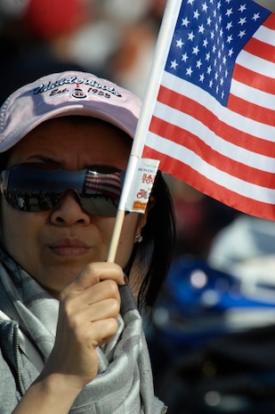 NELLIS AIR FORCE BASE, Nev.-- Maniva Manivahn, a Las Vegas citizen, displays her patriotism by proudly waiving the American flag at the 2009 Aviation Nation Nellis Open House Nov. 14. The Nellis Open House is an opportunity for the Las Vegas community to view aerial demonstrations and static displays of various aircraft from the military. The open house also acts as the final air show of the year for the U.S. Air Force Aerial Demonstration Squadron Thunderbirds.
(U.S. Air Force photo by Master Sgt. Kevin J. Gruenwald)