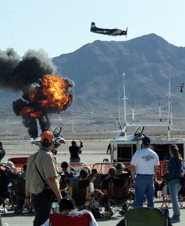 NELLIS AIR FORCE BASE, Nev.-- Spectators are treated to some pyrotechnics during a bombing simulation at the 2009 Aviation Nation Nellis Open House Nov. 14. The Nellis Open House is an opportunity for the Las Vegas community to view aerial demonstrations and static displays of various aircraft from the military. The open house also acts as the final air show of the year for the U.S. Air Force Aerial Demonstration Squadron Thunderbirds.
(U.S. Air Force photo by Master Sgt. Kevin J. Gruenwald)
