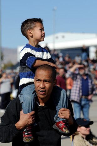 NELLIS AIR FORCE BASE, Nev.-- Joseph Spears and his son, Brandon, watch as an A-10 Thunderbolt II flies by during the Nellis Open House Nov. 14. The open house is an opportunity for the Las Vegas community to view aerial demonstrations and static displays of various aircraft from the military. The open house also acts as the final air show of the year for the U.S. Air Force Air Demonstration Squadron Thunderbirds.
(U.S. Air Force photo by Airman 1st Class Brett Clashman)