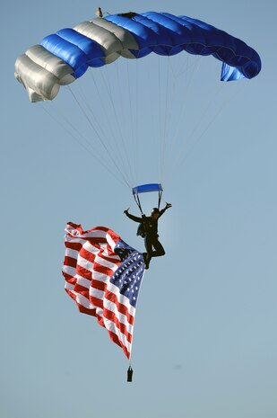 NELLIS AIR FORCE BASE, Nev.-- Cadet 1st Class Joseph Valdez, a senior from the U.S. Air Force Academy in Colorado Springs, Colo., parachutes with the American flag during the National Anthem during the opening ceremony of  the Nellis Open House Nov. 14. The open house is an opportunity for the Las Vegas community to view aerial demonstrations and static displays of various aircraft from the military. The open house also acts as the final air show of the year for the U.S. Air Force Air Demonstration Squadron Thunderbirds.
(U.S. Air Force photo by Airman 1st Class Brett Clashman)