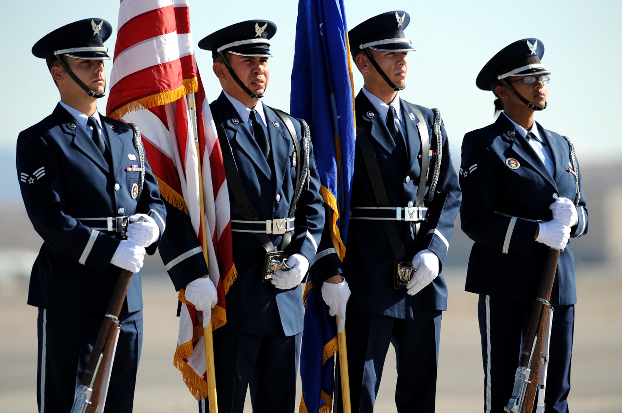 NELLIS AIR FORCE BASE, Nev.-- The Nellis Air Force Base Honor Guard wait to present the colors during the start of the Nellis Open House Nov. 14. The open house is an opportunity for the Las Vegas community to view aerial demonstrations and static displays of various aircraft from the military. The open house also acts as the final air show of the year for the U.S. Air Force Air Demonstration Squadron Thunderbirds.
(U.S. Air Force photo by Airman 1st Class Brett Clashman)