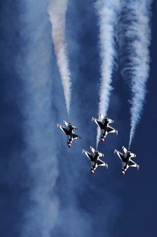 NELLIS AIR FORCE BASE, Nev.-- U.S. Air Force Air Demonstration Team Thunderbirds F-16s perform the arrow head loop during the 2009 Aviation Nation Nellis Open House. The open house is an opportunity for the Las Vegas community to view aerial demonstrations and static displays of various aircraft from the military. The open house also acts as the final air show of the year for the Thunderbirds. (U.S. Air Force photo by Tech. Sgt. Michael R. Holzworth)