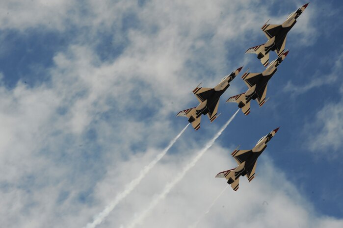NELLIS AIR FORCE BASE, Nev.-- The United States Air Force Air Demonstration Squadron Thunderbirds move into the Arrowhead formation over Nellis during the 2009 Aviation Nation Nellis Open House Nov. 13. The Nellis Open House is an opportunity for the Las Vegas community to view aerial demonstrations and static displays of various aircraft from the military. The open house also acts as the final air show of the year for the Thunderbirds. (U.S. Air Force photo by Master Sgt. Kevin J. Gruenwald)