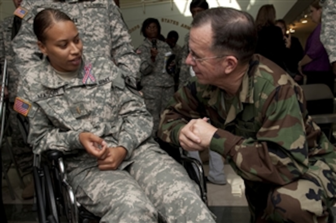 Chairman of the Joint Chiefs of Staff Adm. Mike Mullen, U.S. Navy, speaks with Army 2nd Lt. Brandy Mason at the III Corps Headquarters at Fort Hood, Texas, on Nov. 10, 2009.  Mason was shot in the hip during a Nov. 5 shooting rampage that left 13 dead and 30 wounded.  