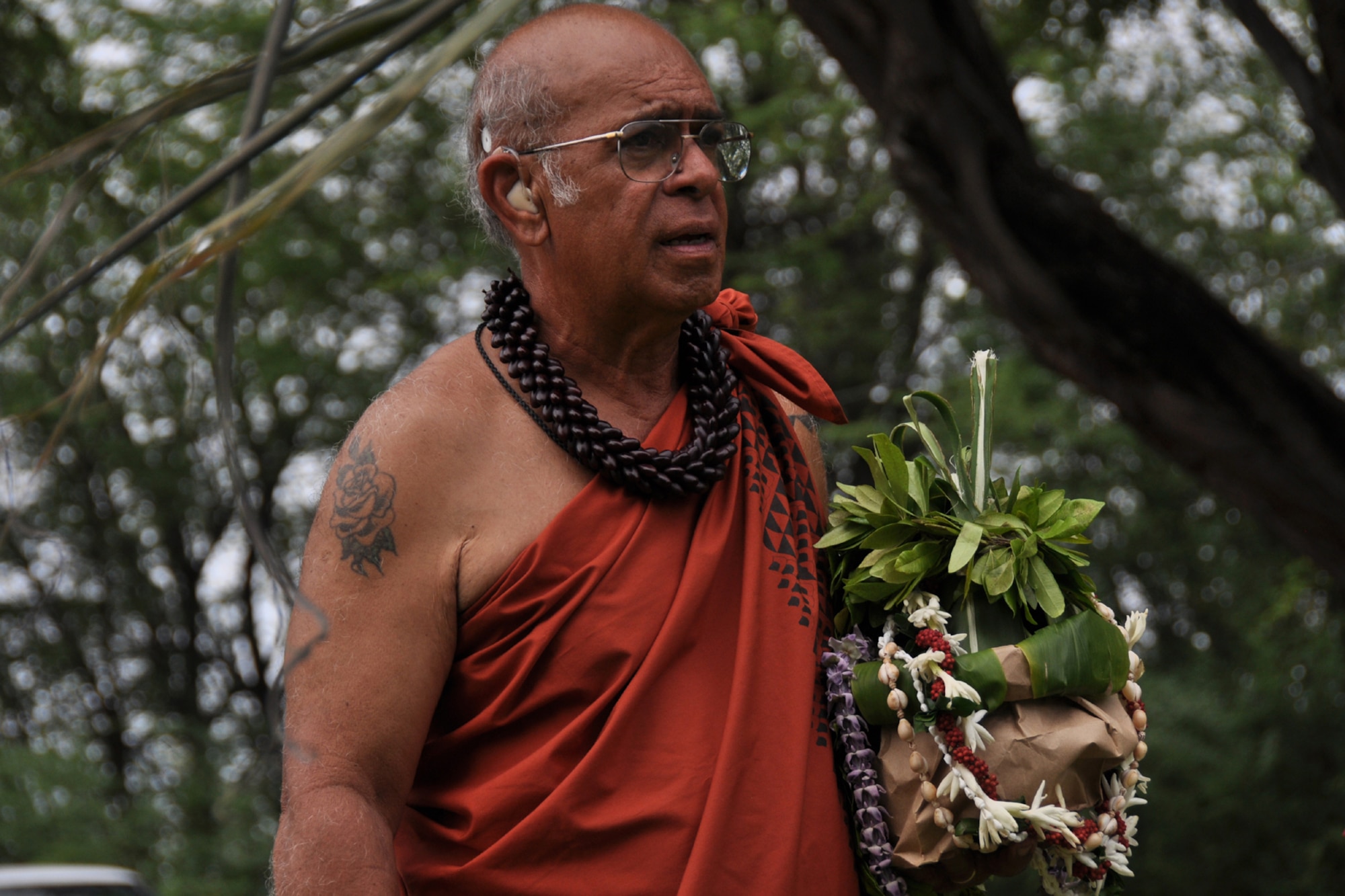 HICKAM AIR FORCE BASE, Hawaii - Shad Kane, a cultural practitioner with the Oahu Council of Hawaiian Civic Clubs, chants an oli, or a blessings at the Haleamau Halealoha burial site on Hickam Nov. 14 following the 7th Annual Kapuaikaula (Hickam) Makahiki (Thanksgiving) festival. Local Hawaiian and Hickam officials gathered at Hickam Harbor on Nov. 14 for the Makahiki festival. The festival involved a ceremonial arrival in canoes, spiritual offerings, five skills competitions and a feast to end the day. According to history texts, the Makahiki was started to honor Lono, the Hawaiian guardian of agriculture, rain, health and peace. The offerings to Lono during the Makahiki were taken to the burial site. (DoD photo by U.S.  Air Force Tech Sgt. Cohen A. Young)